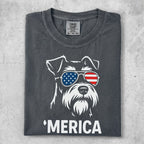 Schnauzer wearing American flag sunglasses with "Merica" text.