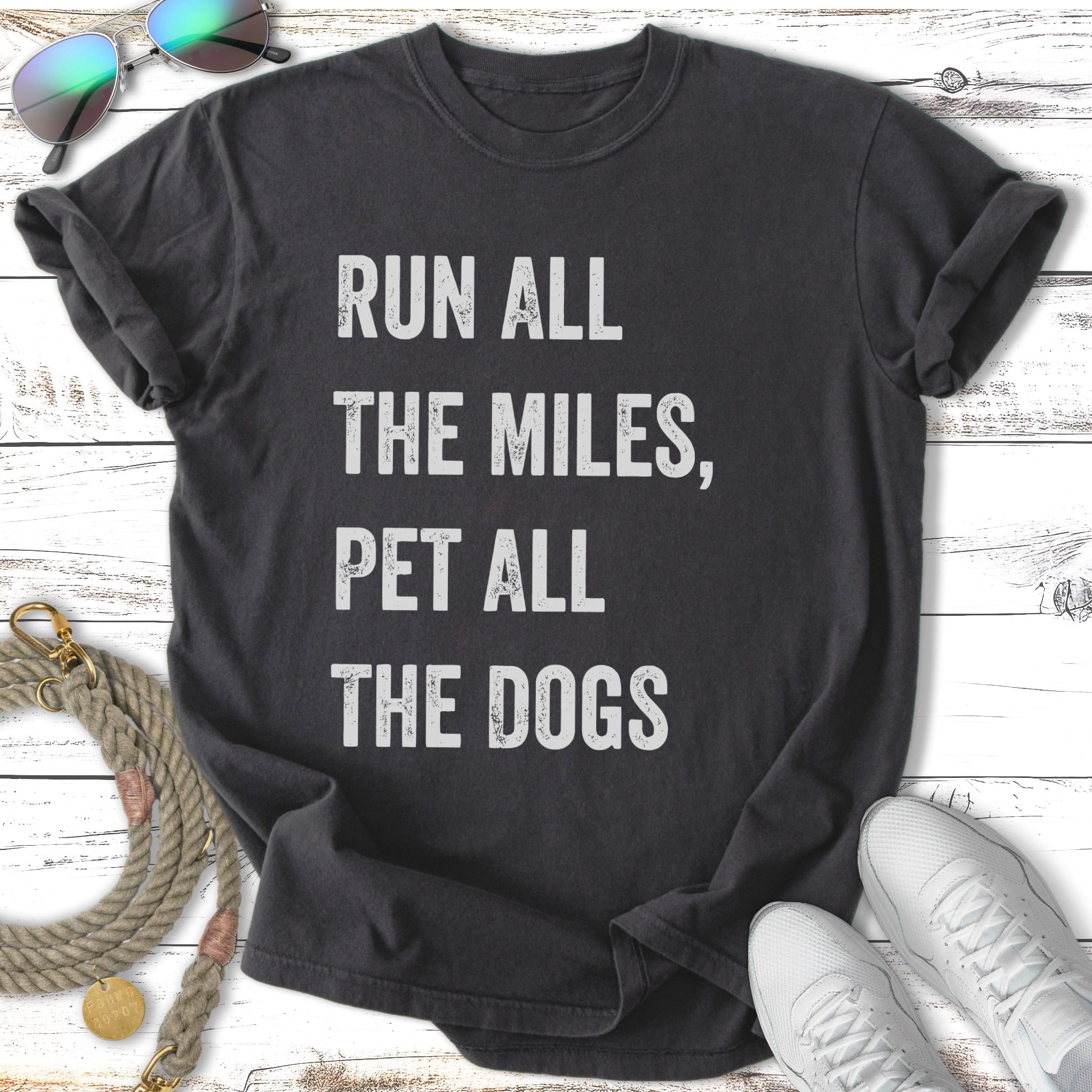 Dark t-shirt with text "RUN ALL THE MILES, PET ALL THE DOGS".