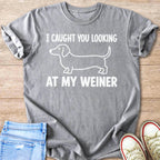 Gray t-shirt with a dachshund outline and text I CAUGHT YOU LOOKING AT MY WEINER.