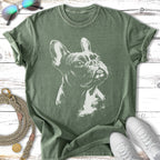 Green t-shirt with a sketch of a French Bulldog and white sneakers.