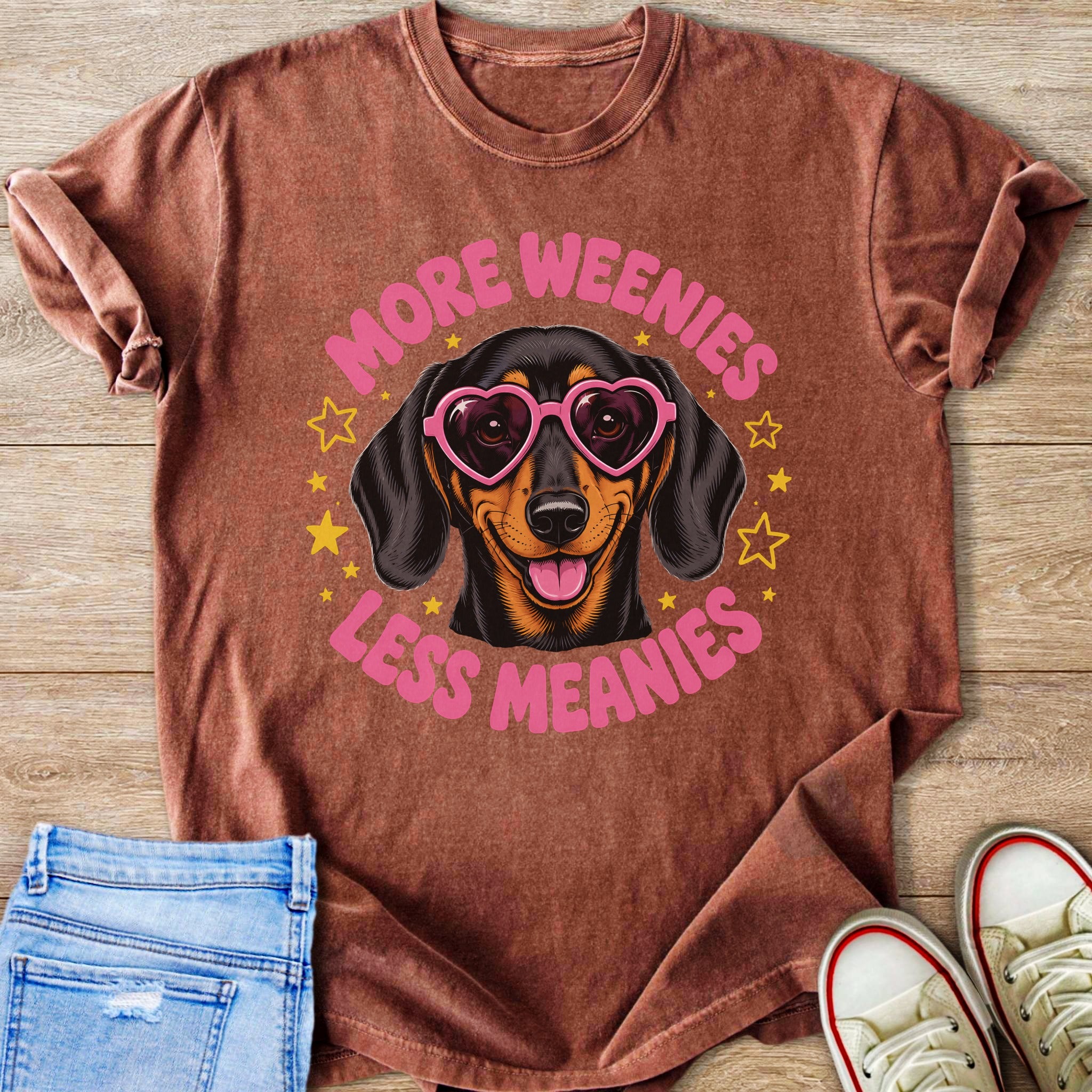 Dachshund wearing heart sunglasses with text "More Weenies Less Meanies".