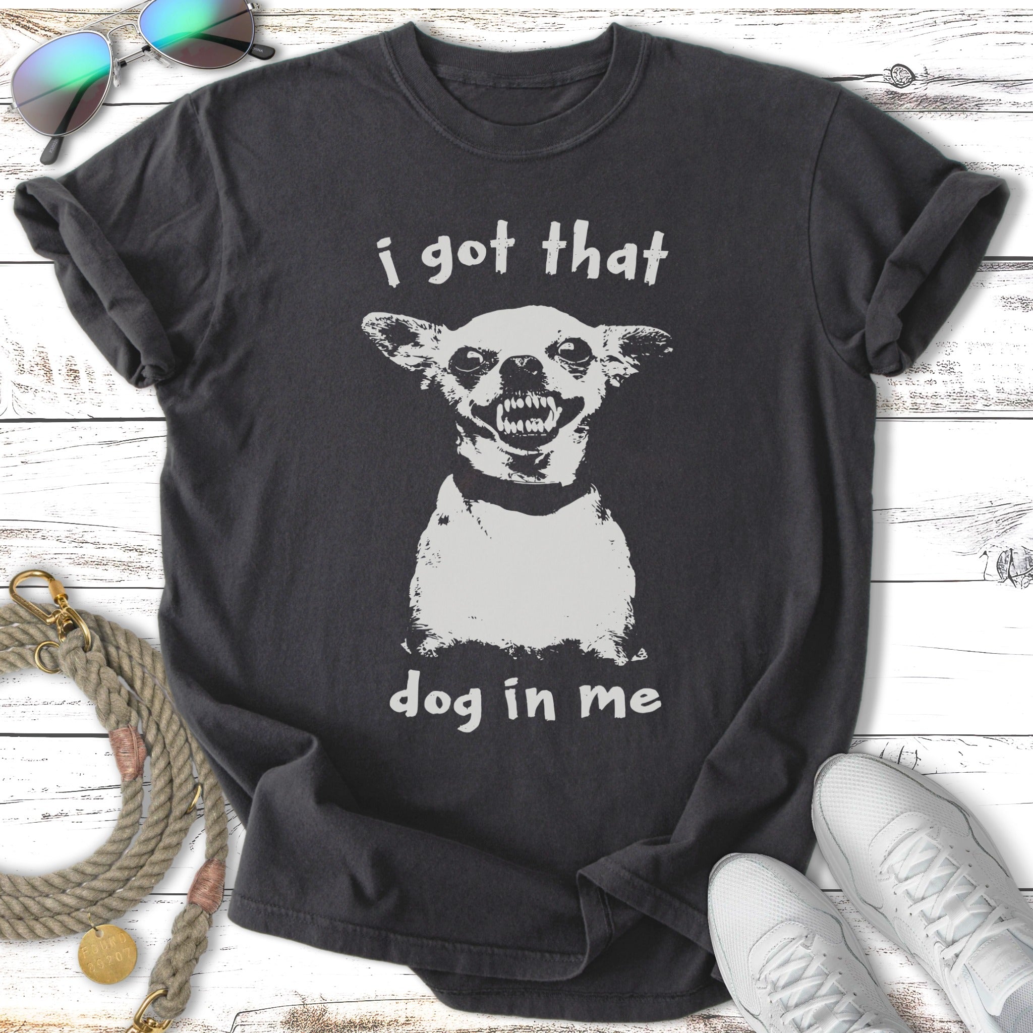 Dark t-shirt with a distressed white graphic of a dog's face and text "i got that dog in me".