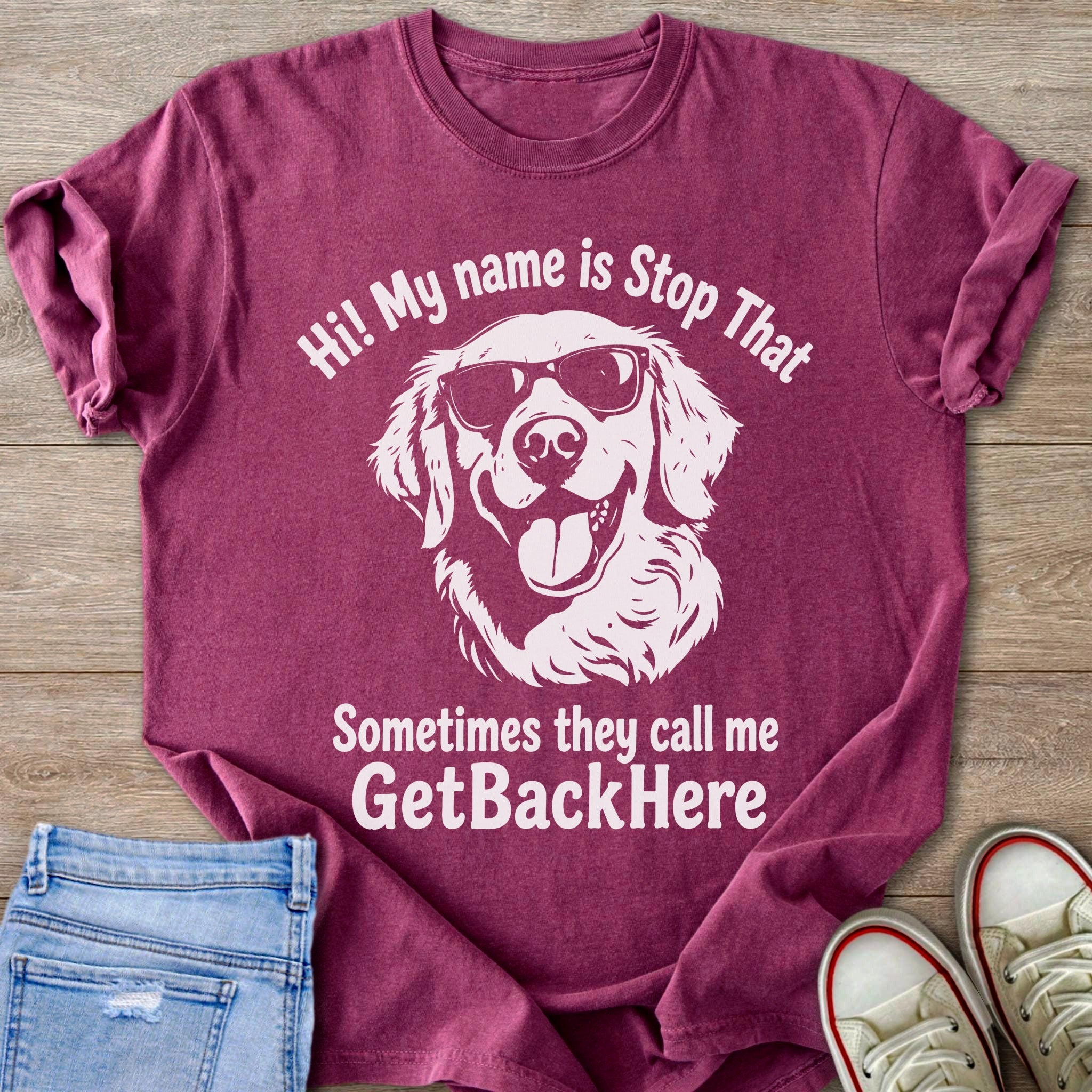 Maroon t-shirt with sunglasses-wearing dog graphic and text.