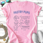Pink t-shirt with "Pastry Pups" text and various dog breeds depicted as pastries.