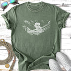 Green t-shirt with a white sketched koala sleeping in a hammock.