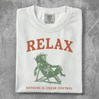 White t-shirt with "RELAX" and man in chair graphic.