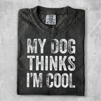 Black t-shirt with white text "MY DOG THINKS I'M COOL".