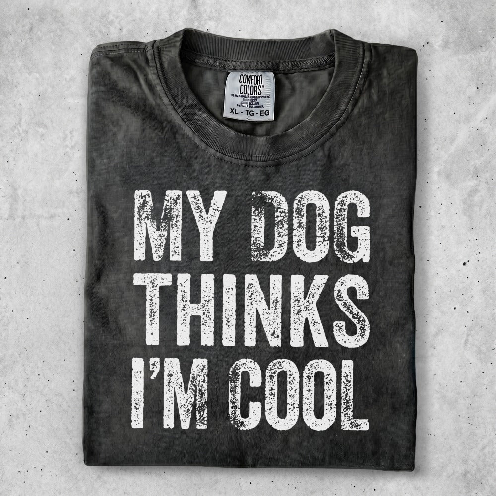 Black t-shirt with white text "MY DOG THINKS I'M COOL".
