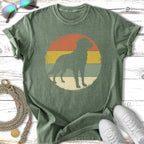Distressed green t-shirt with a vintage dog silhouette in a colorful sun graphic.