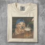 Golden retriever wearing a blue hat, looking at a beer being poured.