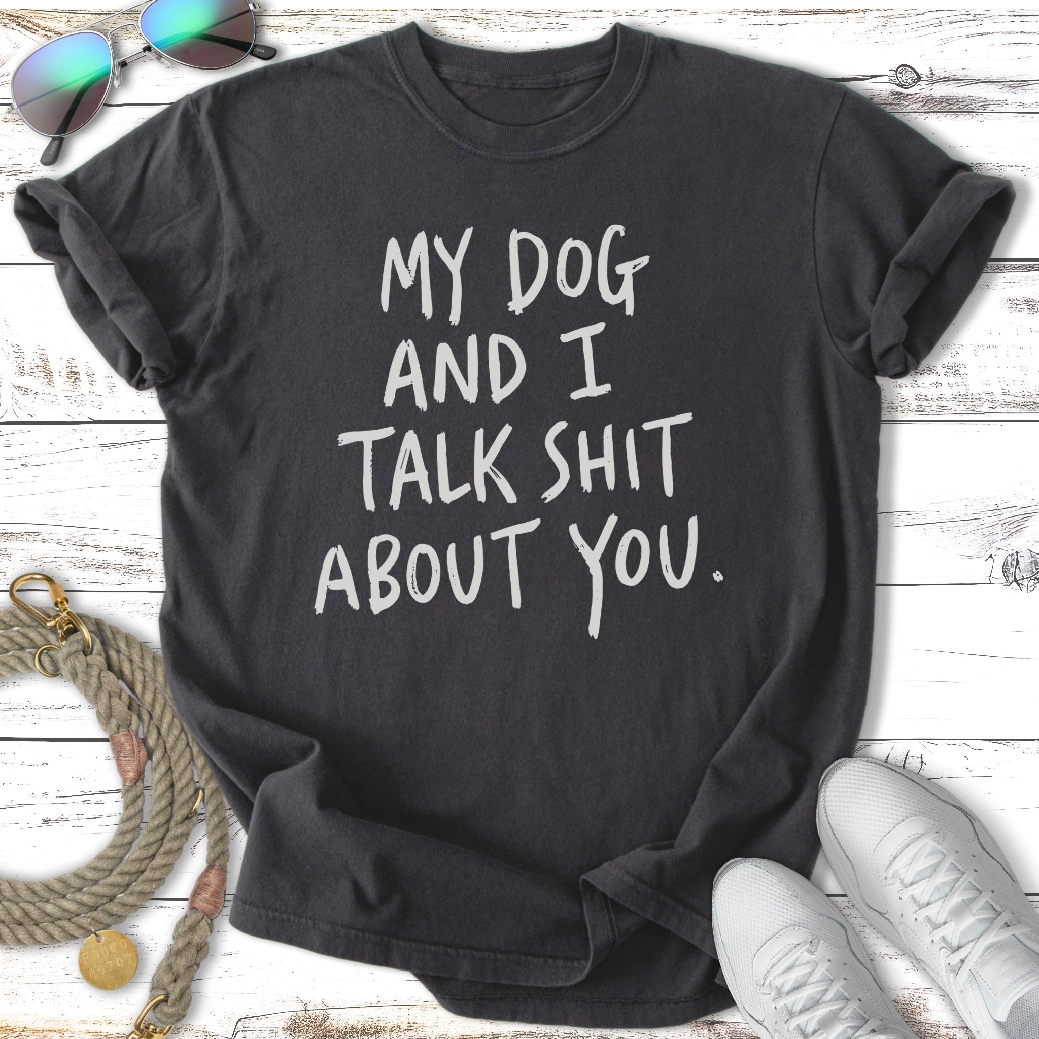 Dark t-shirt with white text: "My dog and I talk shit about you."