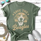 Green t-shirt with a graphic of a beagle dog and text "Save the Beagles".