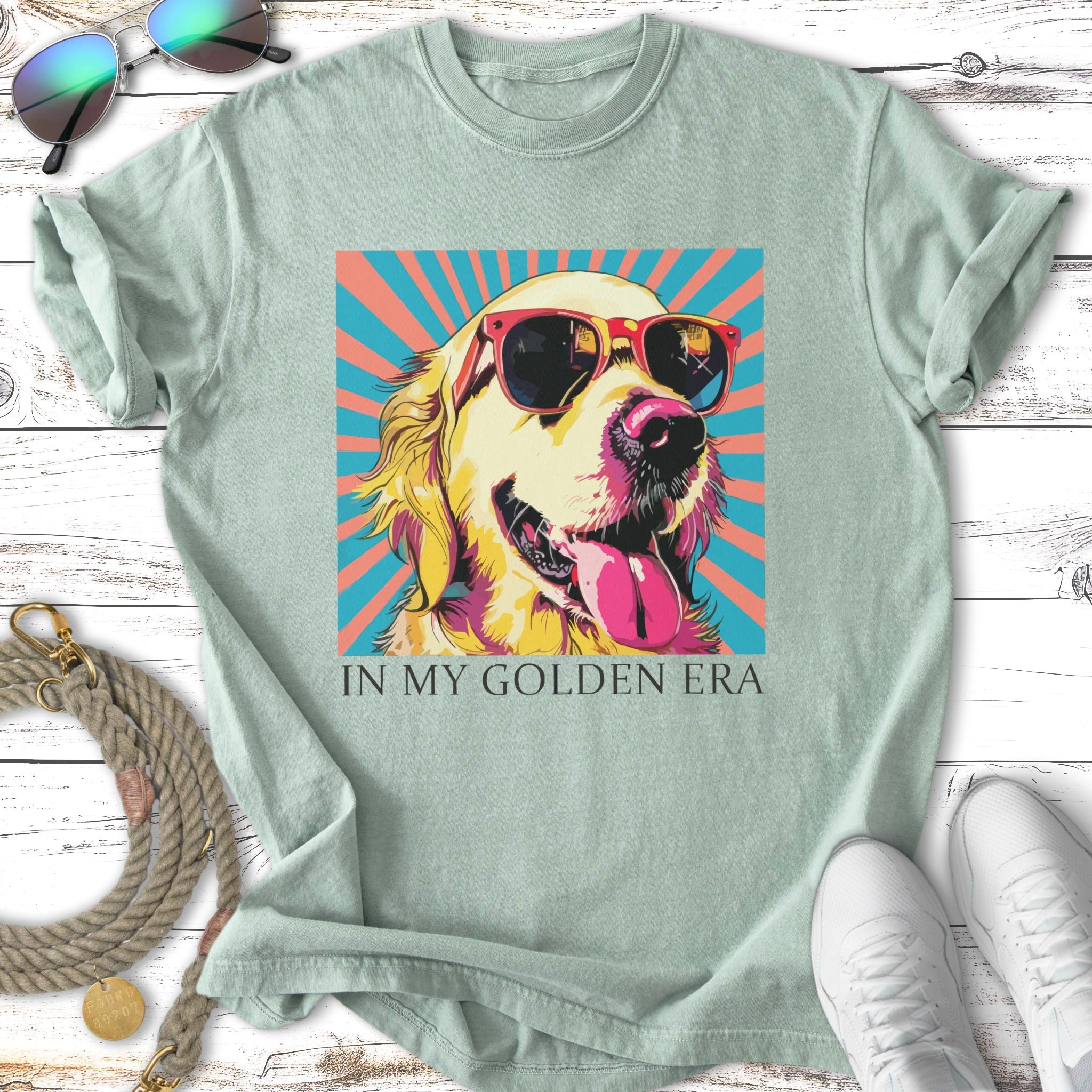 Golden retriever wearing sunglasses, tongue out, with text "IN MY GOLDEN ERA".