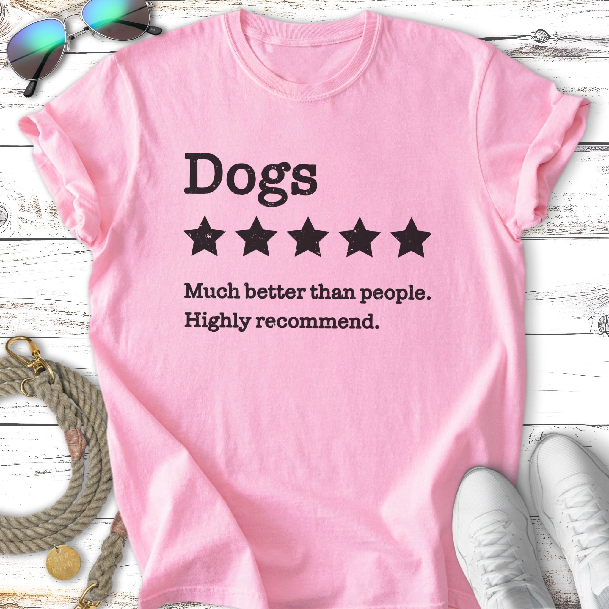 Pink t-shirt with "Dogs, 5 stars, Much better than people. Highly recommend."