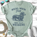 Light green t-shirt with dachshund and text "Real Men Play With Their Weiners".