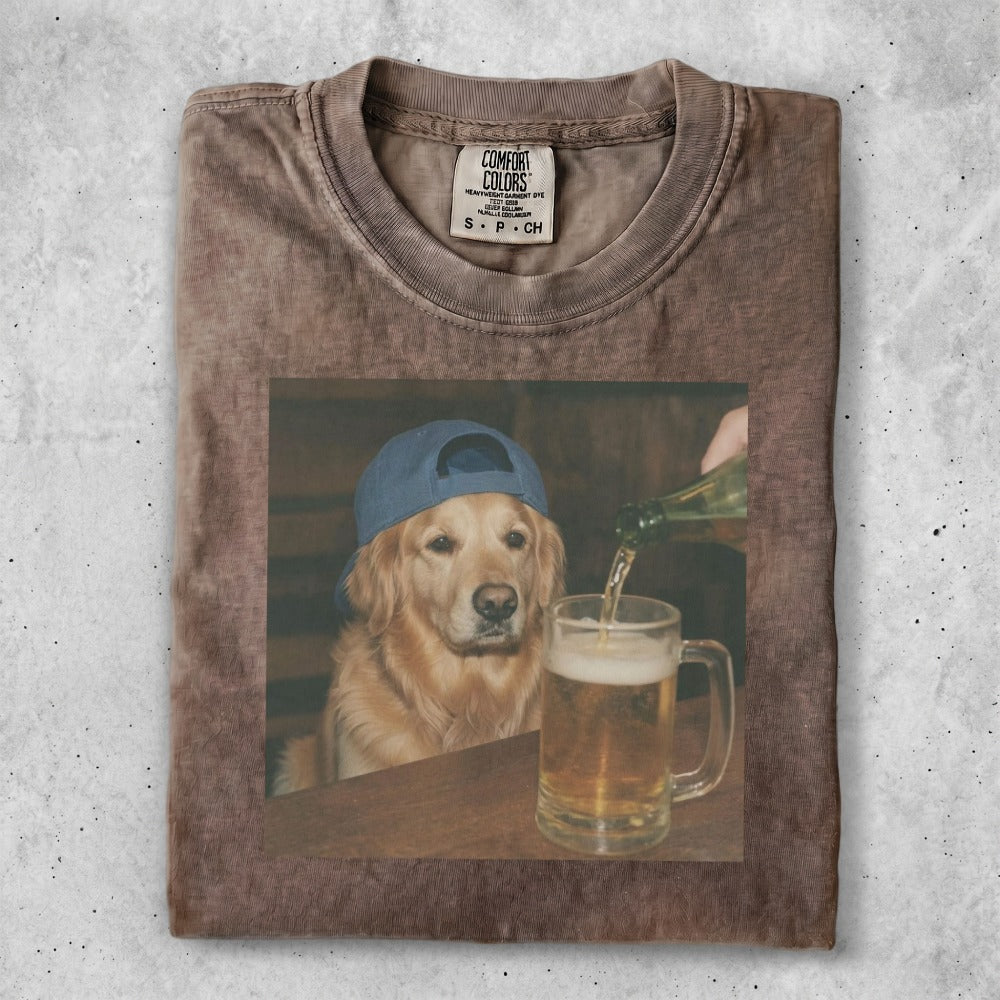 Golden retriever wearing a blue hat pours beer into a mug.