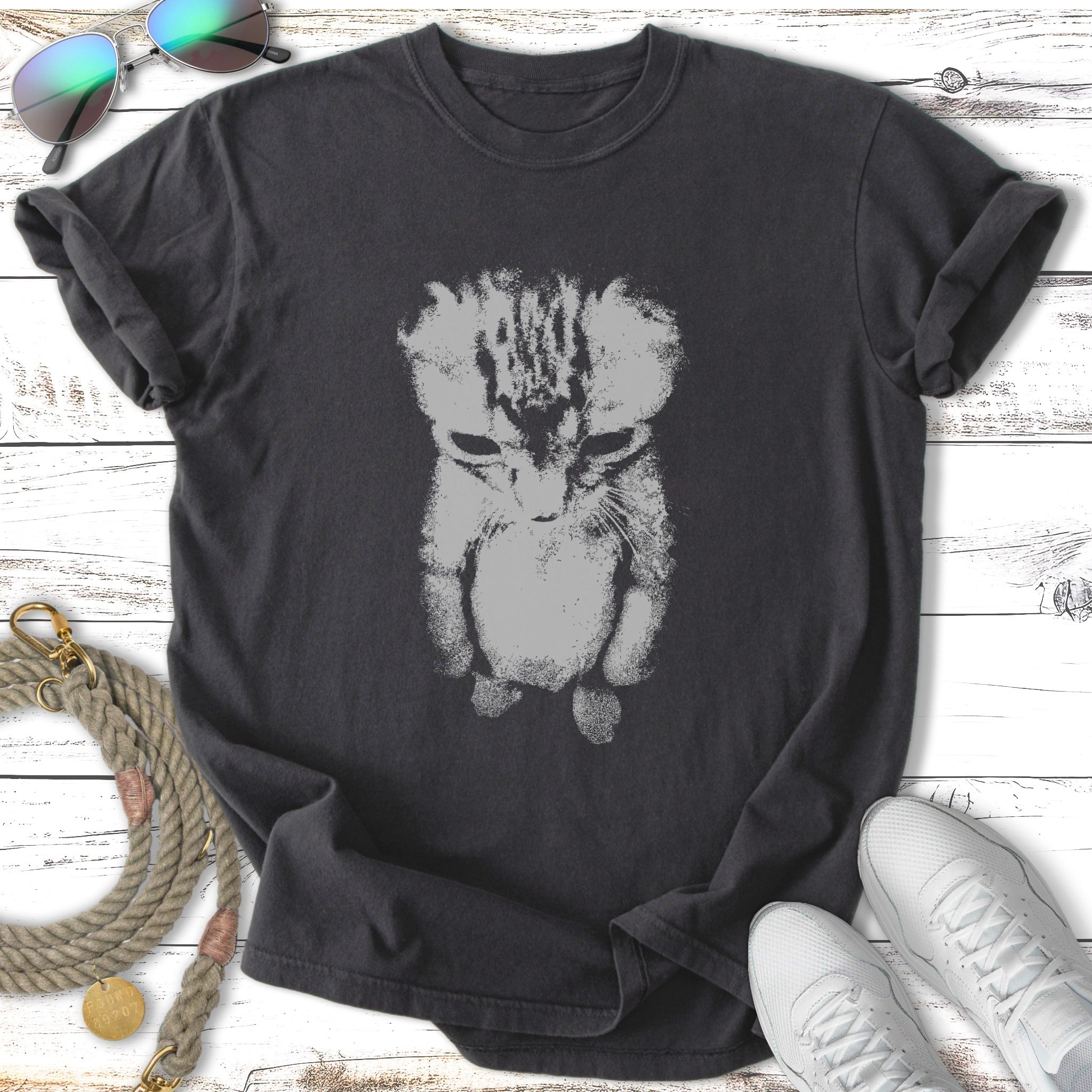 Black t-shirt with a stylized light grey kitten graphic.