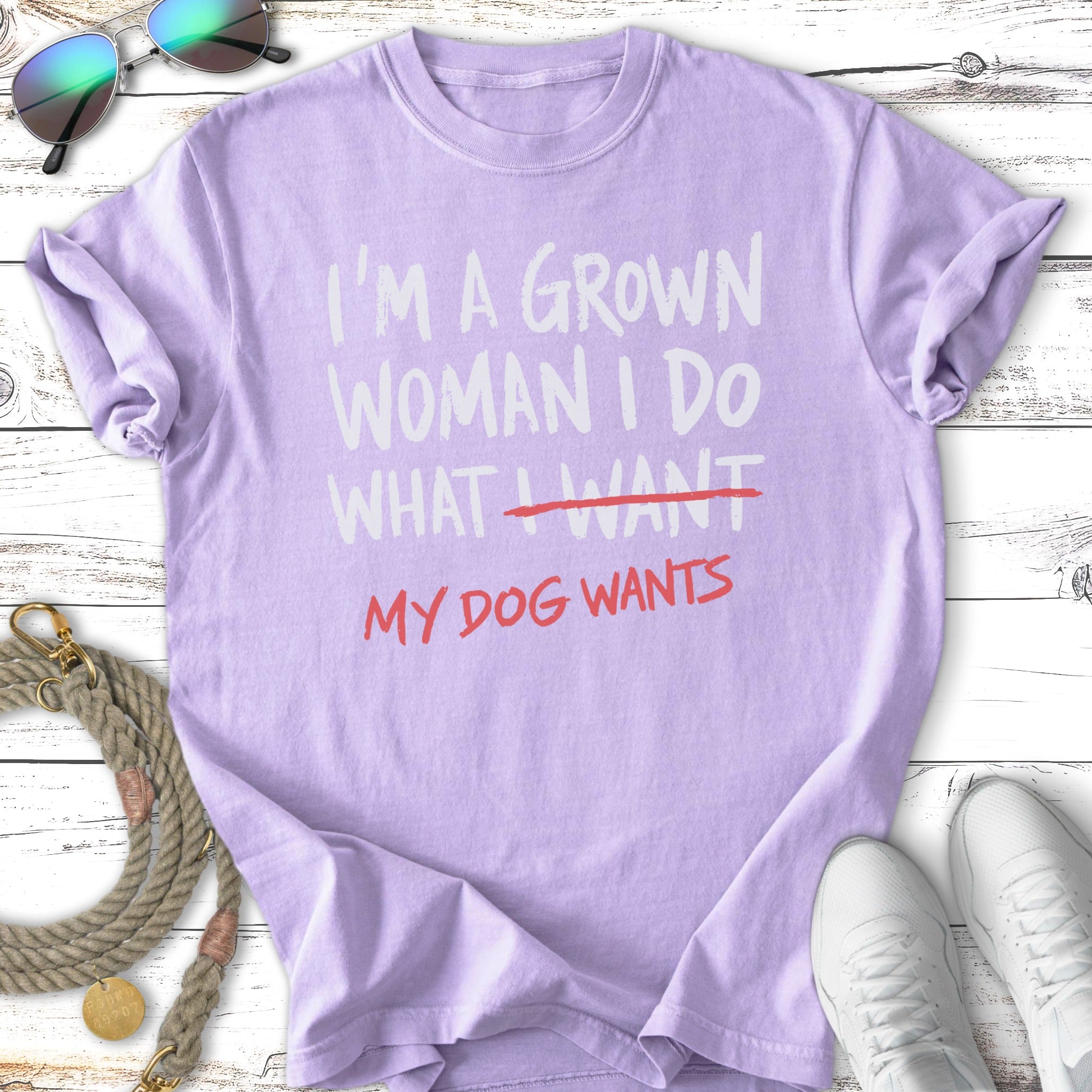 Purple t-shirt with "I'm a grown woman I do what I want MY DOG WANTS" text.