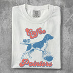 White t-shirt with "Coffee and Pointers" text and a dog near a coffee cup.