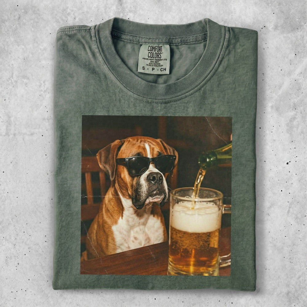 Boxer dog wearing sunglasses, with beer being poured into a mug.