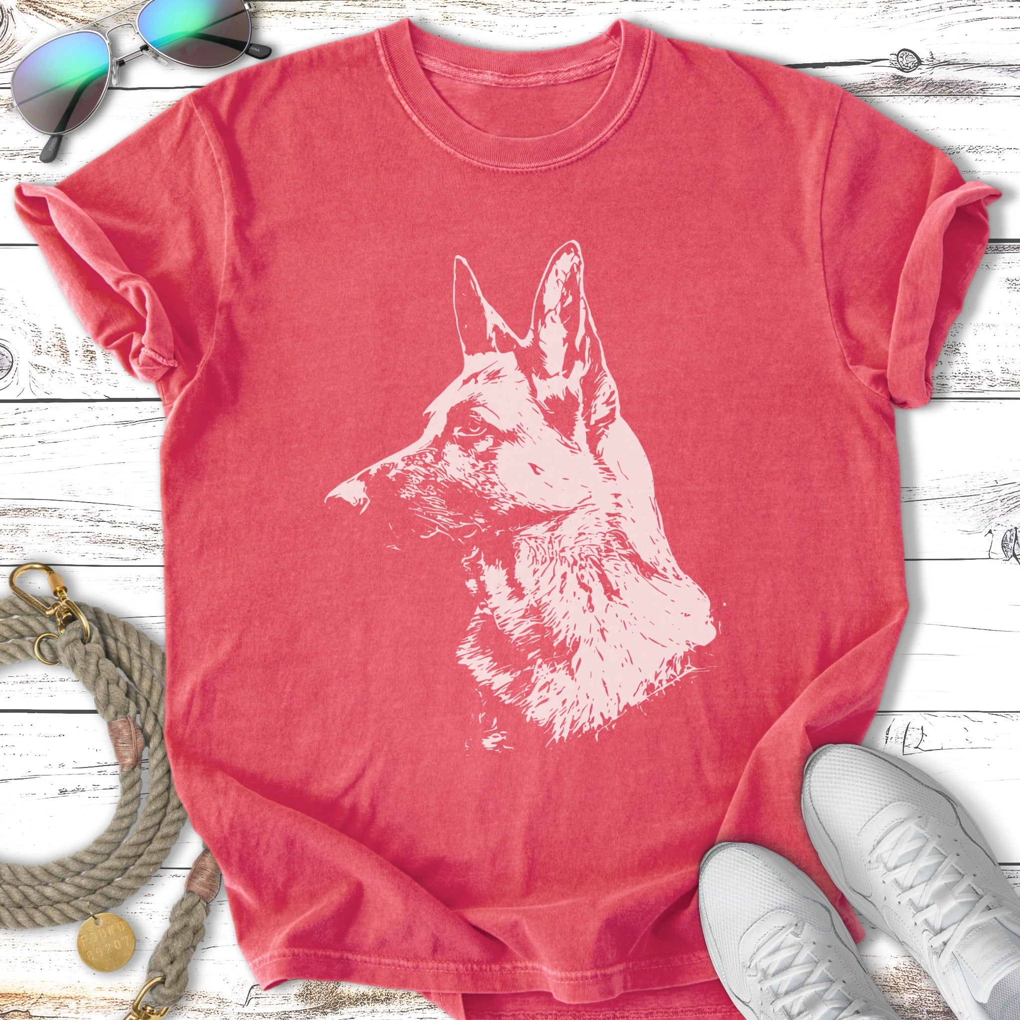 German Shepherd dog portrait on a coral t-shirt with white outline.