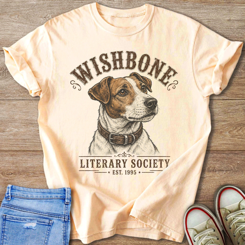 Peach t-shirt with dog illustration and text "WISHBONE LITERARY SOCIETY EST. 1995".