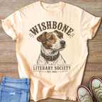 Peach t-shirt with dog illustration and text "WISHBONE LITERARY SOCIETY EST. 1995".