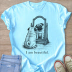 Light blue t-shirt with pug looking in mirror and "I am beautiful." text.