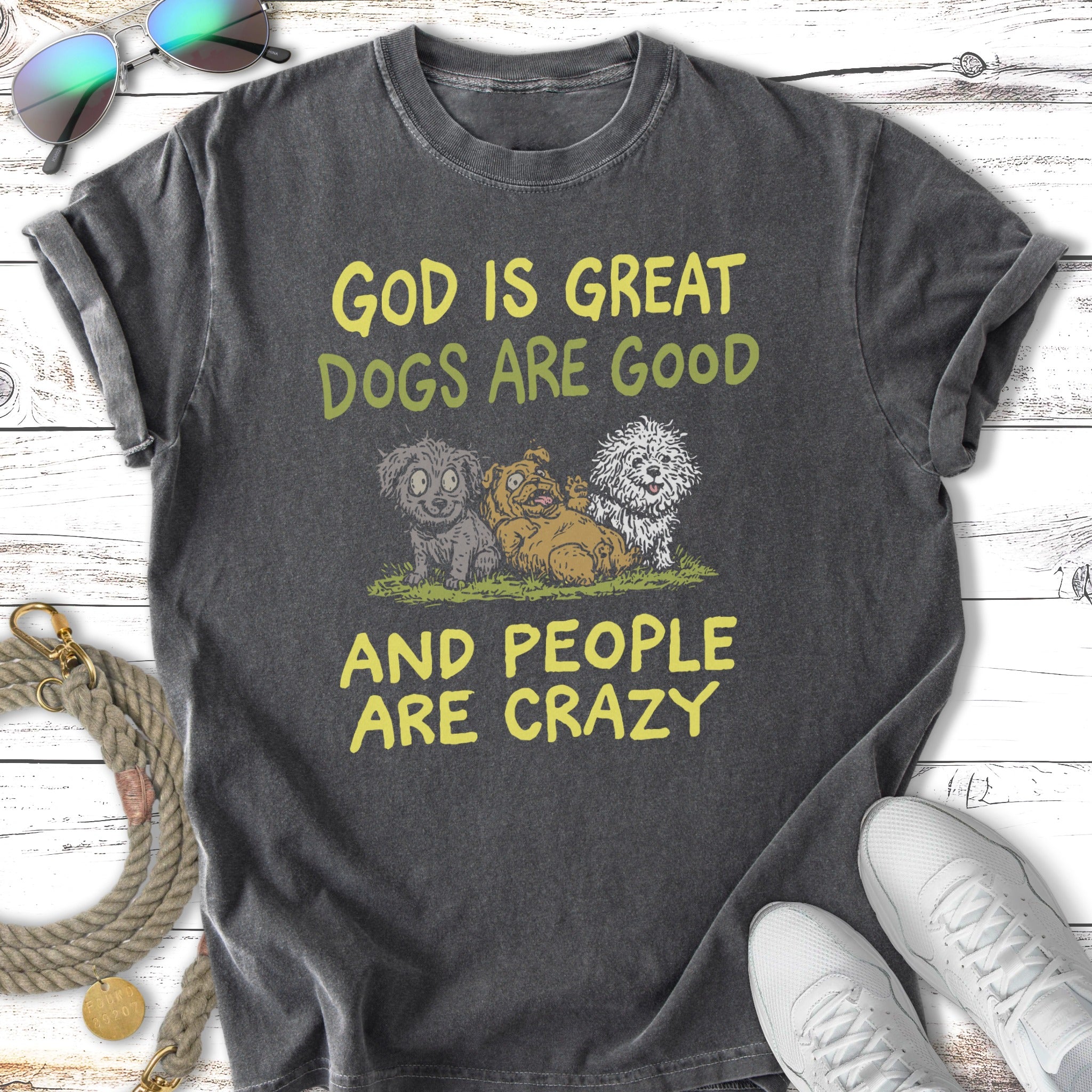 T-shirt with "God is Great Dogs are Good And People Are Crazy" and cartoon dogs.