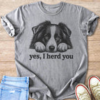 Grey t-shirt with black sketch of a dog and text "yes, I herd you".