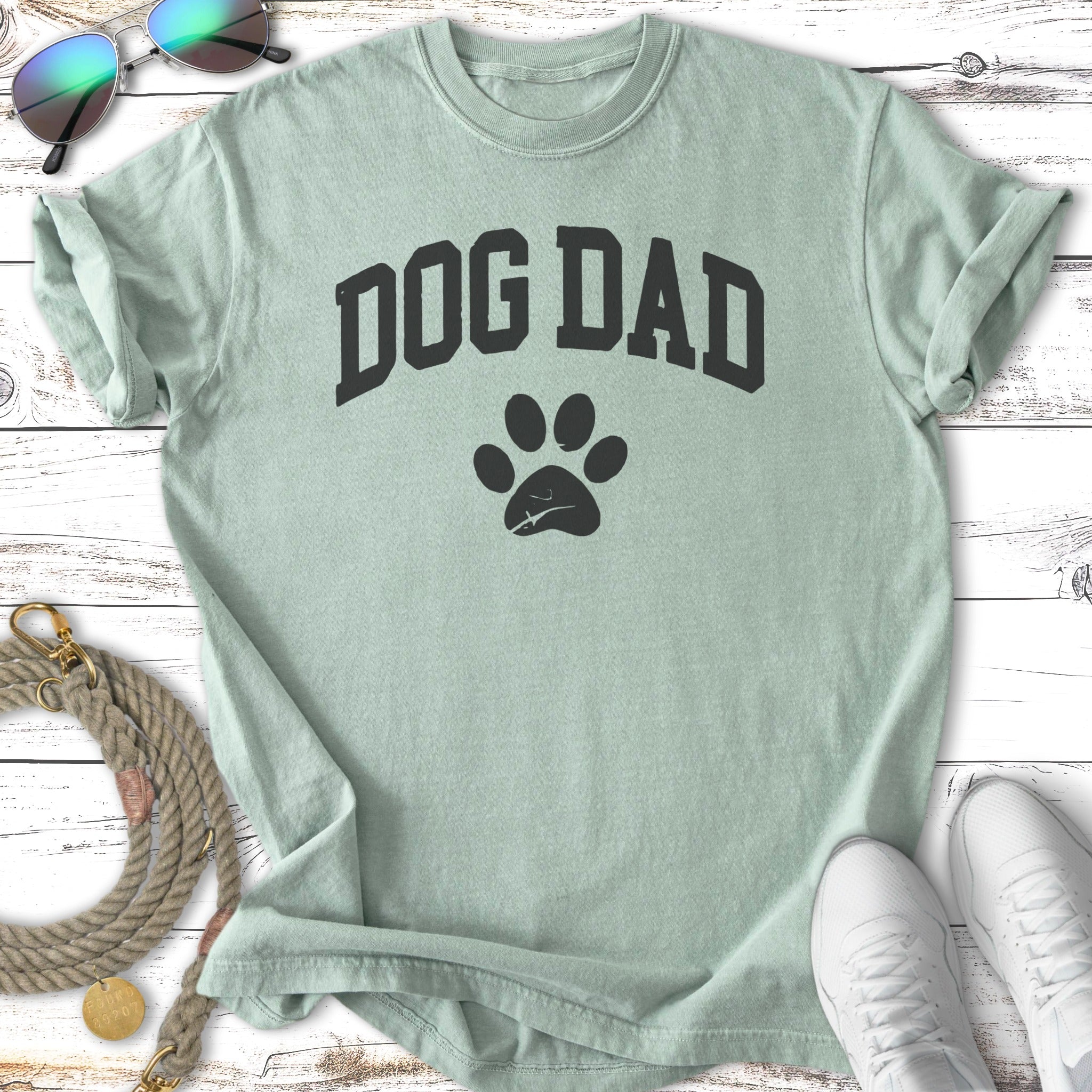 Light mint t-shirt with "DOG DAD" and paw print graphic.
