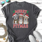 Three pitbulls in Santa hats and Christmas lights, text "MERRY PITMAS".