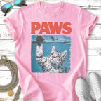 Pink t-shirt with a cat reaching out of water, "PAWS" text.
