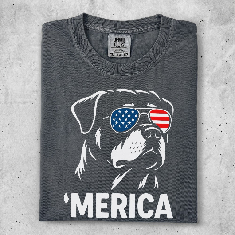 Rottweiler wearing American flag sunglasses and "MERICA" text.