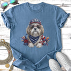 Shih Tzu wearing sunglasses, bandana, and USA hat, with floral accents.