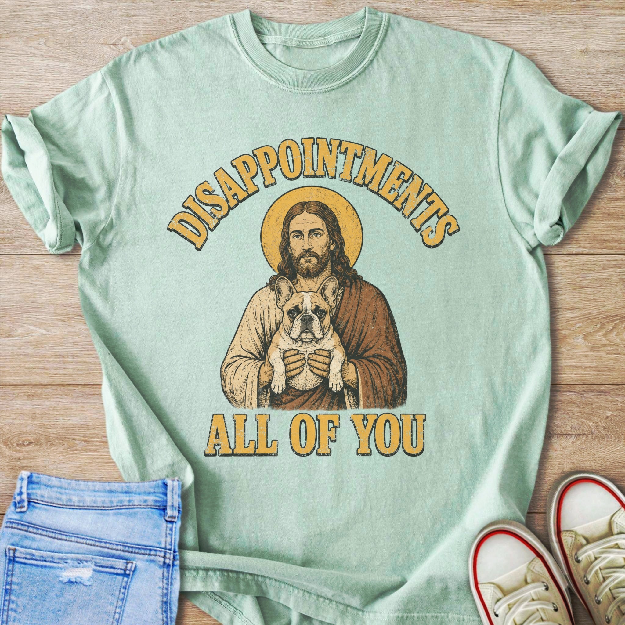 Jesus holding a French bulldog under text "Disappointments All Of You".