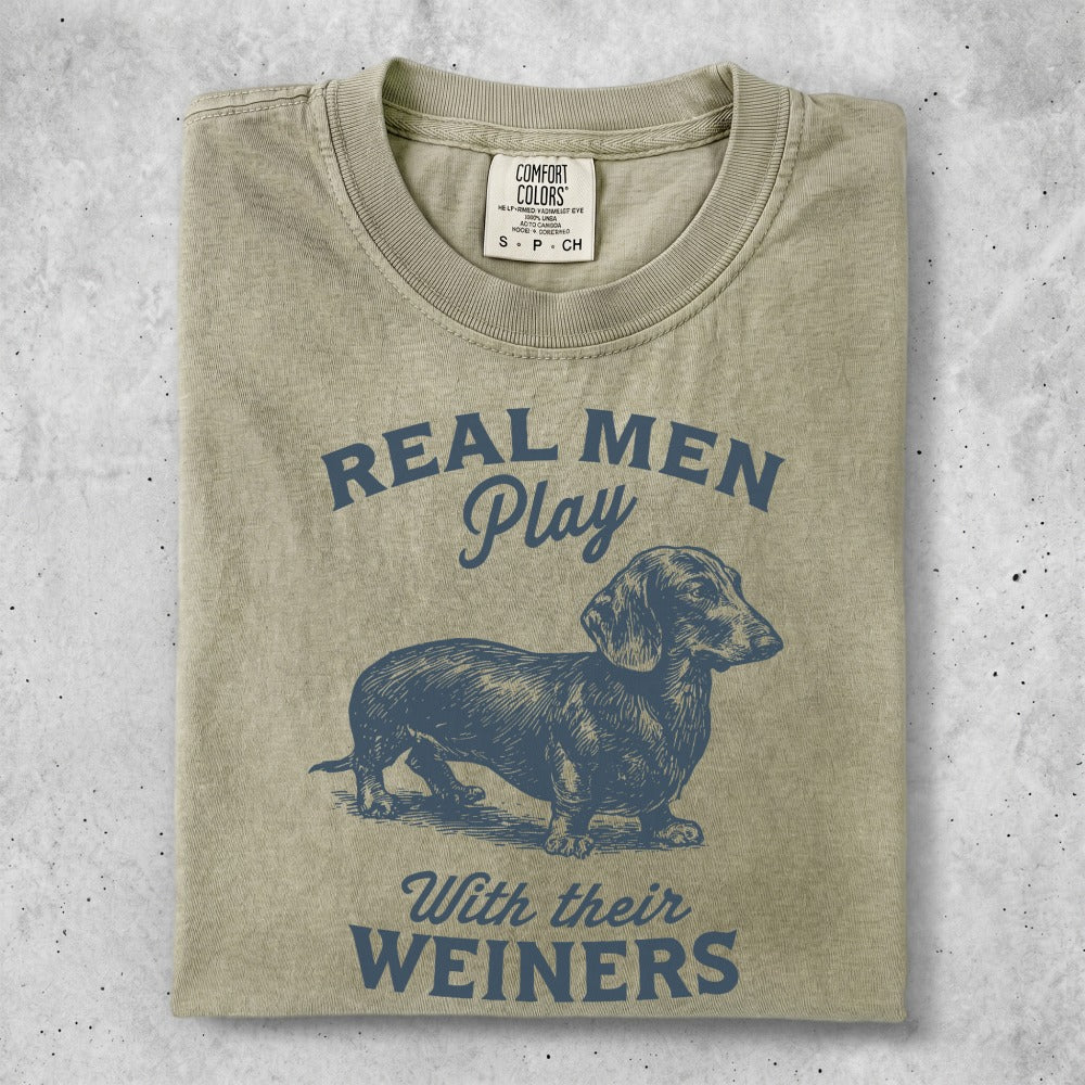T-shirt with blue dachshund graphic and "Real Men Play With Their Weiners" text.
