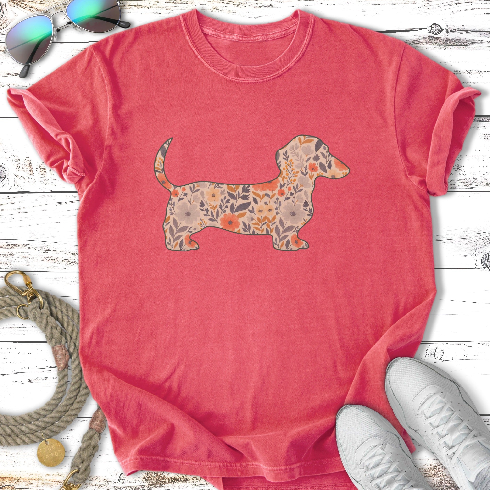 Red t-shirt with a floral dachshund silhouette graphic.