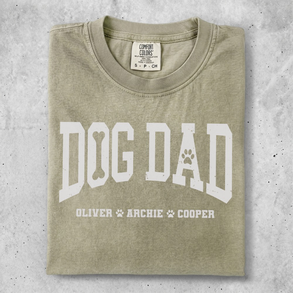 Olive green t-shirt with "DOG DAD" and names Oliver, Archie, Cooper.