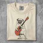 Cream t-shirt with illustration of a pug playing a red electric guitar.