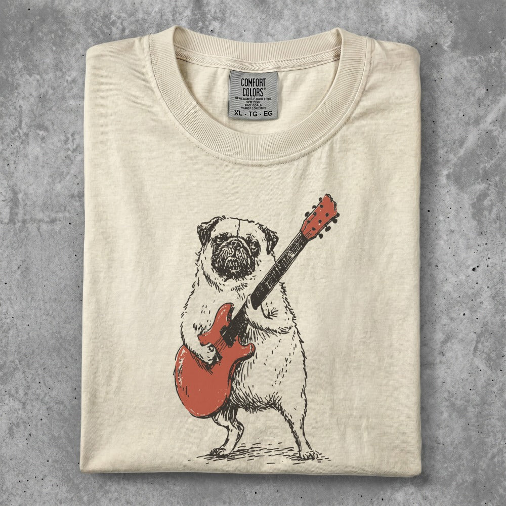 Cream t-shirt with illustration of a pug playing a red electric guitar.