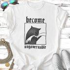 Black cat with "become ungovernable" text on a white t-shirt.