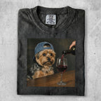 Yorkshire terrier wearing a baseball cap with wine being poured into a glass.