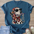 Dalmatian wearing sunglasses and a colorful scarf, holding a crochet hook and yarn.
