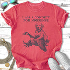 Distressed t-shirt with graphic of a dog on a goose, text reads "I AM A CONDUIT FOR NONSENSE".