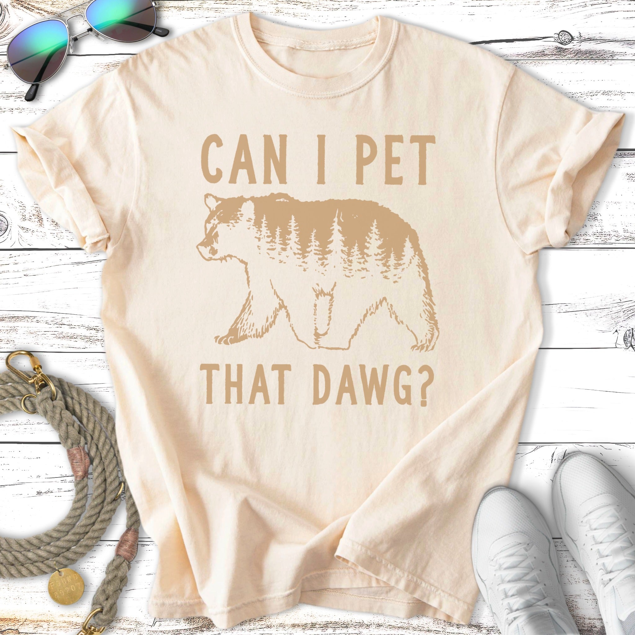 Cream t-shirt with bear and trees graphic, text reads "CAN I PET THAT DAWG?".