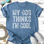 Blue t-shirt with "MY DOG THINKS I'M COOL" printed in white text.