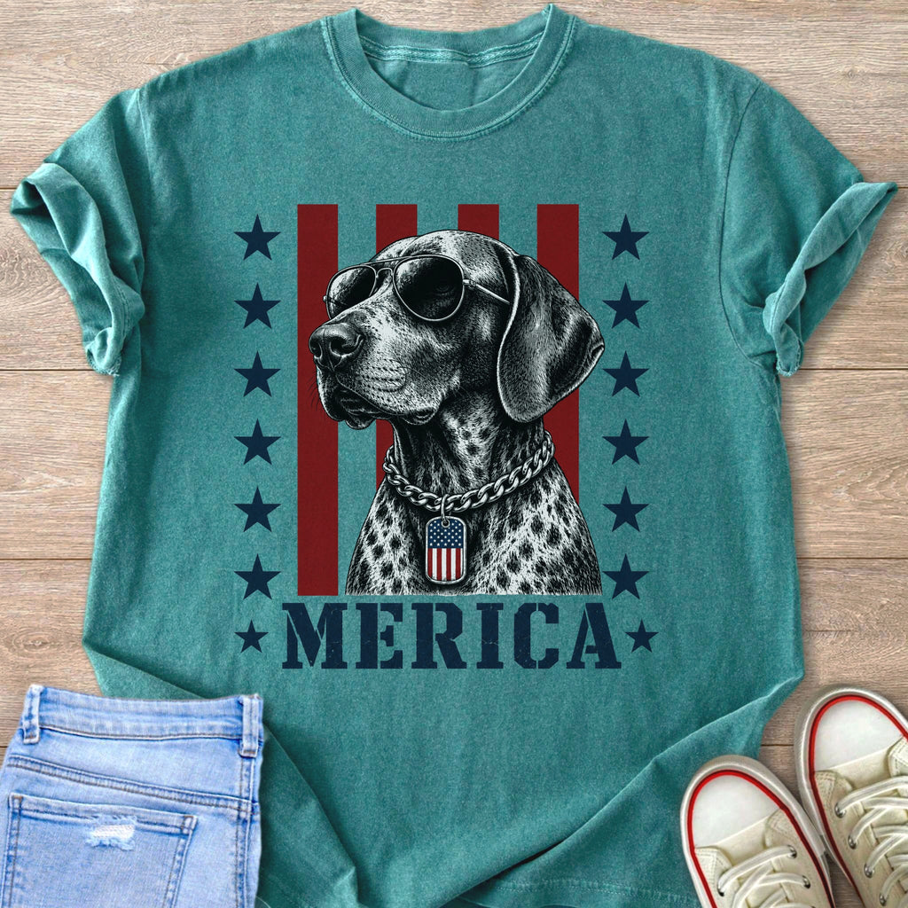 Dog wearing sunglasses and an American flag tag with "MERICA" text.