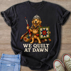Golden retriever in a cape, holding a seam ripper and a patchwork quilt.