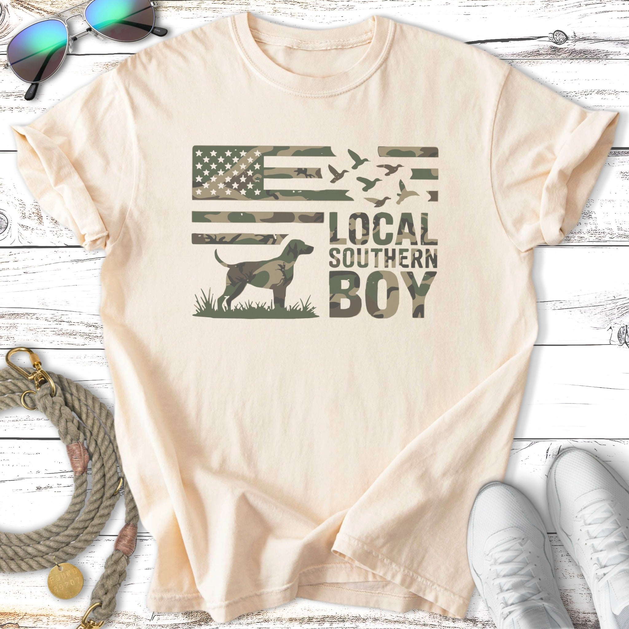 Cream t-shirt with camouflage American flag and "Local Southern Boy" text.